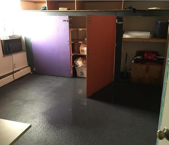 Room with standing water on the floor