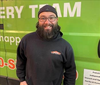 Team Member photo of Brandon standing in front of a SERVPRO vehicle