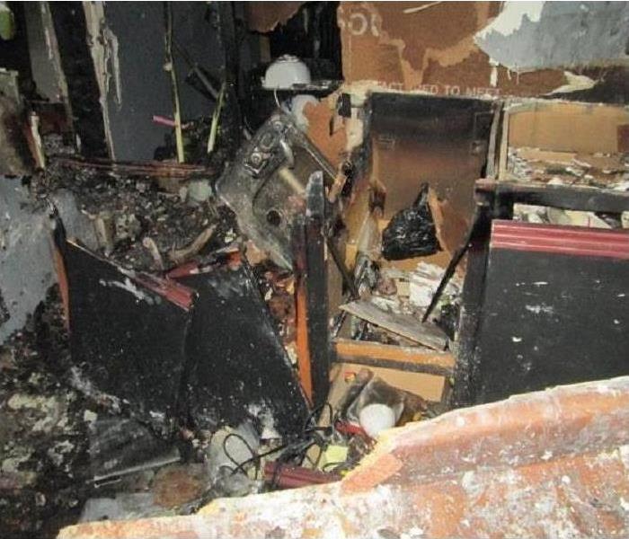 Furniture in a room and all personal belongings damaged by fire
